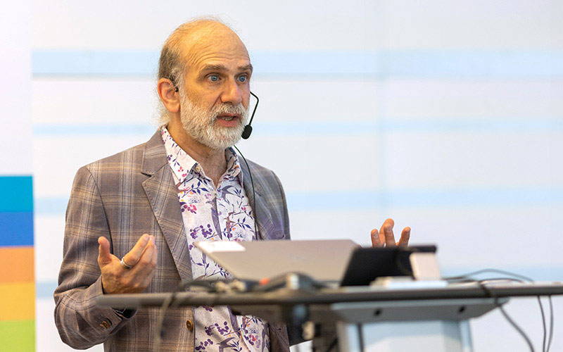 speaker stands at the podium